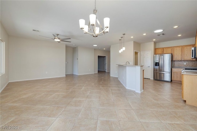 2221 River Grove Dr, Henderson, NV 89044 - kitchen featuring stainless steel appliances, ceiling fan, open floor plan, recessed lighting, and a chandelier
