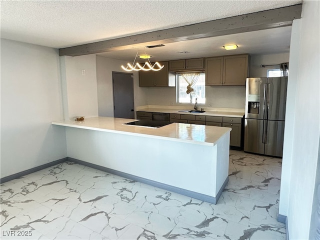 1304 Bonita Ave, Las Vegas, NV 89104 - kitchen with stainless steel fridge with ice dispenser, light marble finish flooring, a sink, a peninsula, and a textured ceiling
