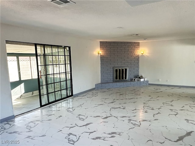 1304 Bonita Ave, Las Vegas, NV 89104 - unfurnished living room with a textured ceiling, baseboards, a fireplace, and marble finish flooring