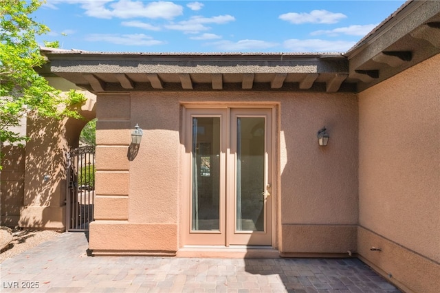 9025 Loggers Mill Ave, Las Vegas, NV 89143 - view of exterior entry featuring stucco siding and a gate
