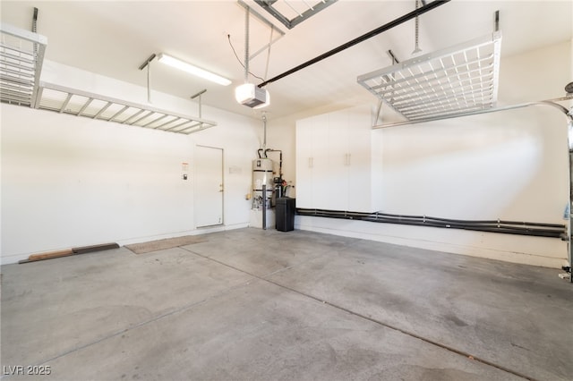9025 Loggers Mill Ave, Las Vegas, NV 89143 - garage with a garage door opener and strapped water heater