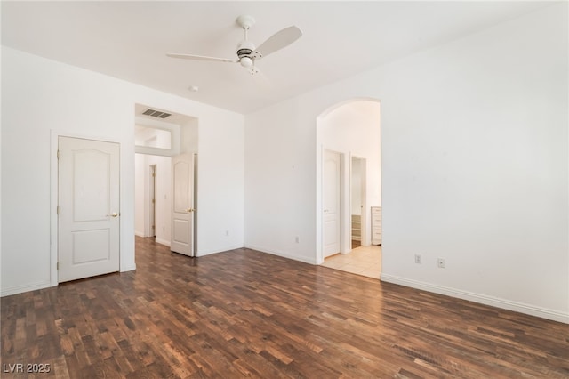 9025 Loggers Mill Ave, Las Vegas, NV 89143 - spare room with arched walkways, wood finished floors, ceiling fan, and baseboards