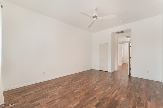 9025 Loggers Mill Ave, Las Vegas, NV 89143 - unfurnished room featuring dark wood-type flooring, a ceiling fan, and baseboards