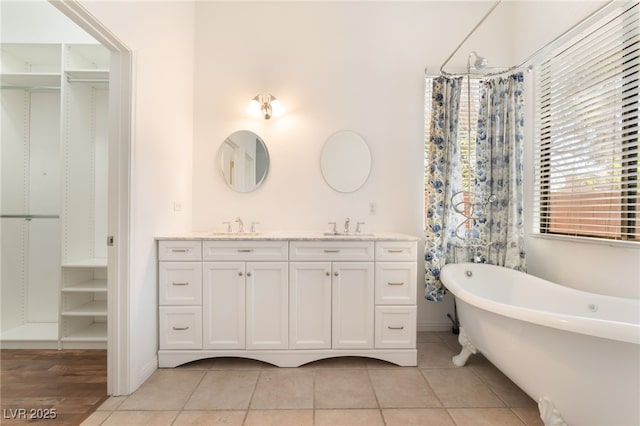 9025 Loggers Mill Ave, Las Vegas, NV 89143 - bathroom with a soaking tub, double vanity, and baseboards