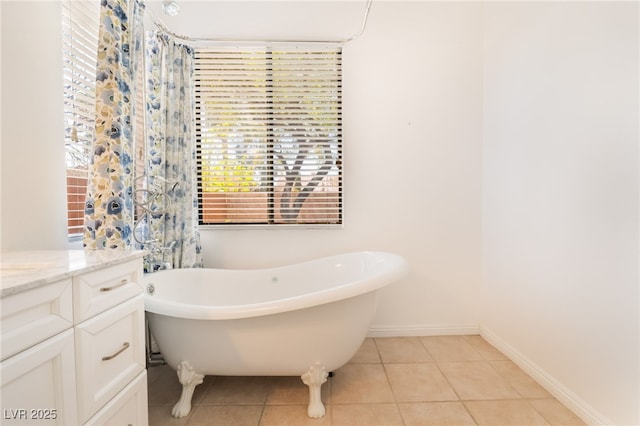 9025 Loggers Mill Ave, Las Vegas, NV 89143 - full bath featuring a freestanding bath, tile patterned flooring, vanity, and baseboards