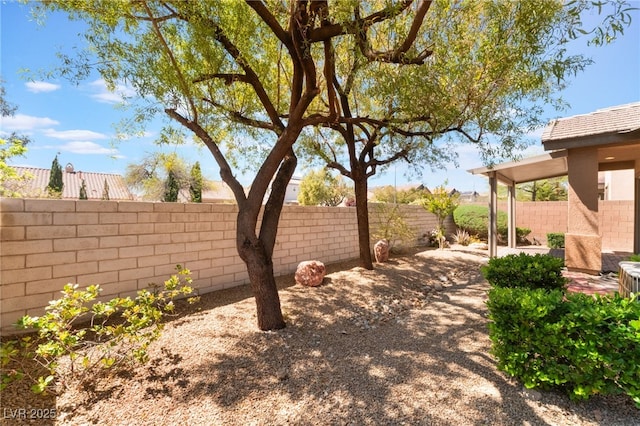 9025 Loggers Mill Ave, Las Vegas, NV 89143 - fenced backyard with a patio