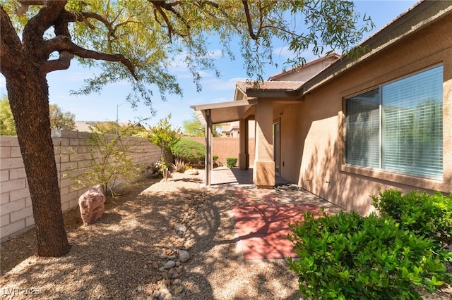 9025 Loggers Mill Ave, Las Vegas, NV 89143 - fenced backyard featuring a patio area