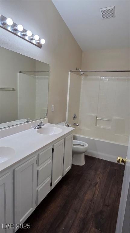 6113 Desert Haven Rd, Las Vegas, NV 89130 - bathroom featuring double vanity, wood finished floors, toilet, and shower / tub combination