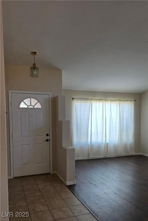 6113 Desert Haven Rd, Las Vegas, NV 89130 - tiled foyer with plenty of natural light and baseboards