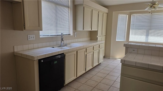 6113 Desert Haven Rd, Las Vegas, NV 89130 - kitchen featuring dishwasher, a sink, tile counters, ceiling fan, and light tile patterned floors