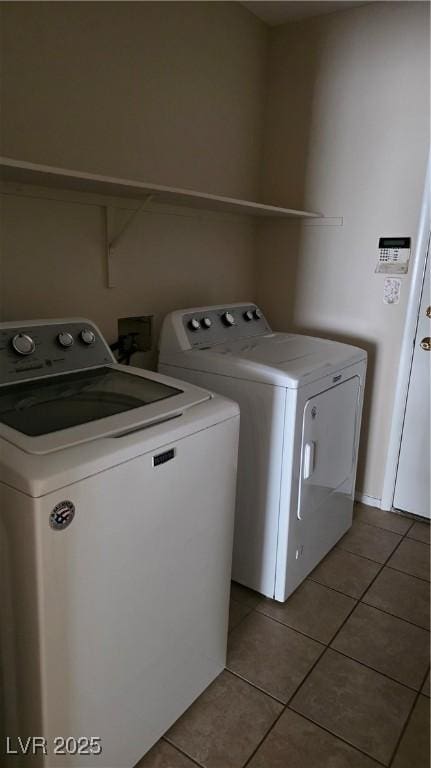 6113 Desert Haven Rd, Las Vegas, NV 89130 - washroom with washer and clothes dryer and light tile patterned flooring