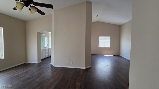 6113 Desert Haven Rd, Las Vegas, NV 89130 - unfurnished room with ceiling fan, arched walkways, dark wood-type flooring, and vaulted ceiling