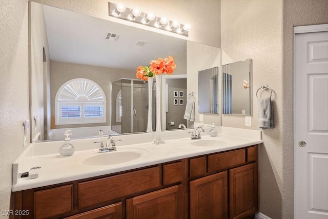 8340 Jeremiahs Lodge Ave, Las Vegas, NV 89131 - full bath featuring a textured wall, double vanity, and a stall shower