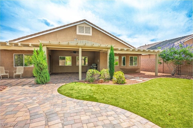 8340 Jeremiahs Lodge Ave, Las Vegas, NV 89131 - back of house featuring stucco siding, a pergola, ceiling fan, and a patio