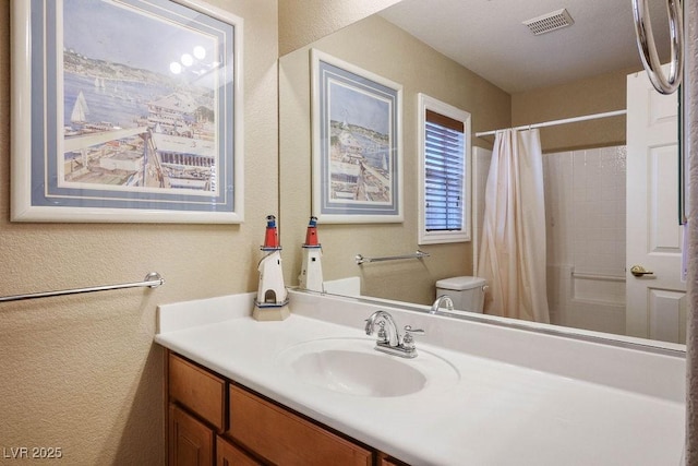 8340 Jeremiahs Lodge Ave, Las Vegas, NV 89131 - full bathroom featuring vanity, toilet, and a textured wall