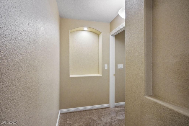 8340 Jeremiahs Lodge Ave, Las Vegas, NV 89131 - hall with carpet flooring, a textured wall, and baseboards