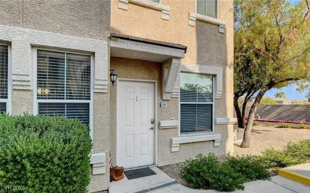 9975 Peace Way Unit 1069, Las Vegas, NV 89147 - doorway to property with stucco siding