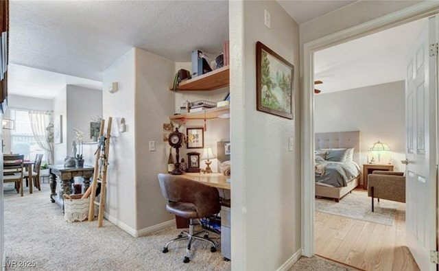 9975 Peace Way Unit 1069, Las Vegas, NV 89147 - carpeted office featuring baseboards, built in desk, and a textured ceiling