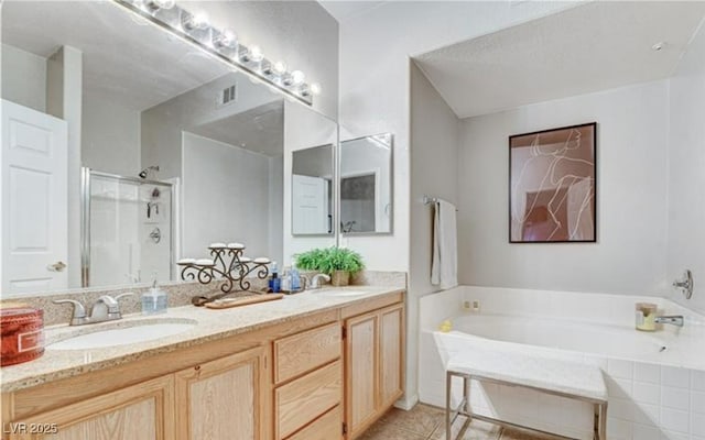 9975 Peace Way Unit 1069, Las Vegas, NV 89147 - full bath with a garden tub, double vanity, a stall shower, and tile patterned flooring