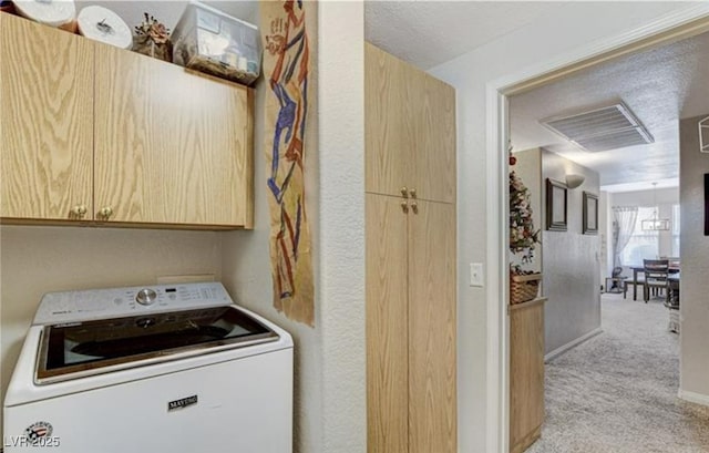 9975 Peace Way Unit 1069, Las Vegas, NV 89147 - laundry area featuring washer / dryer, cabinet space, and light colored carpet
