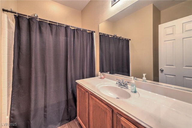 5528 Stone Lagoon St, North Las Vegas, NV 89031 - bathroom with vanity, a shower with shower curtain, and wood finished floors