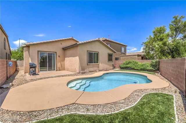 5528 Stone Lagoon St, North Las Vegas, NV 89031 - view of pool with a patio area, a fenced backyard, and a grill