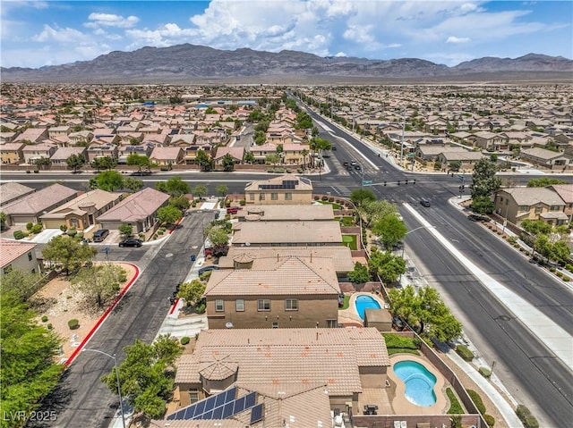 5528 Stone Lagoon St, North Las Vegas, NV 89031 - aerial view of residential area with a mountain backdrop and a pool area
