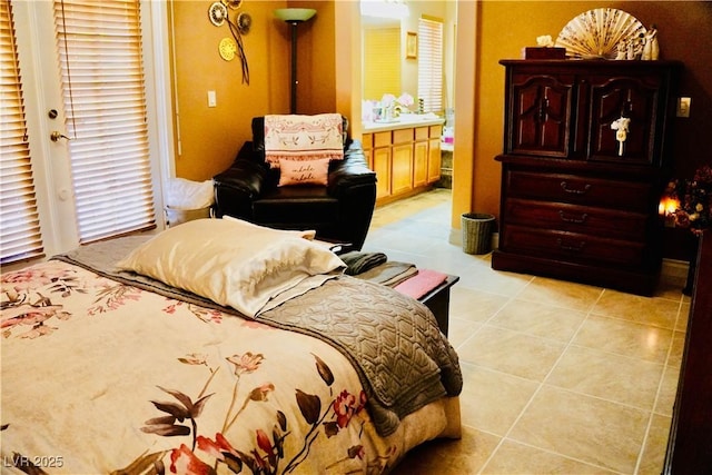 9355 W Viking Rd, Las Vegas, NV 89147 - bedroom with light tile patterned floors and connected bathroom
