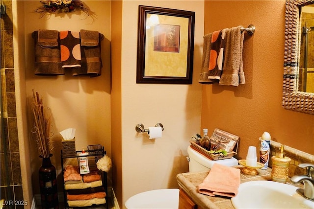 9355 W Viking Rd, Las Vegas, NV 89147 - bathroom with toilet, vanity, and a shower