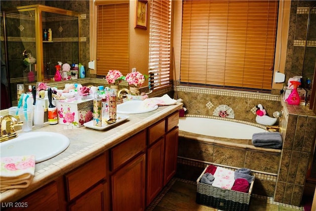 9355 W Viking Rd, Las Vegas, NV 89147 - full bath with a garden tub, double vanity, and a shower stall