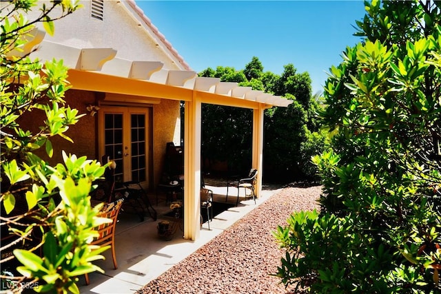 9355 W Viking Rd, Las Vegas, NV 89147 - view of yard featuring french doors and a patio