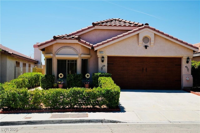 9355 W Viking Rd, Las Vegas, NV 89147 - mediterranean / spanish-style home with an attached garage, a tile roof, driveway, and stucco siding
