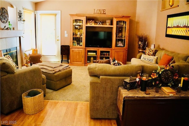 9355 W Viking Rd, Las Vegas, NV 89147 - living room featuring wood finished floors and a tile fireplace