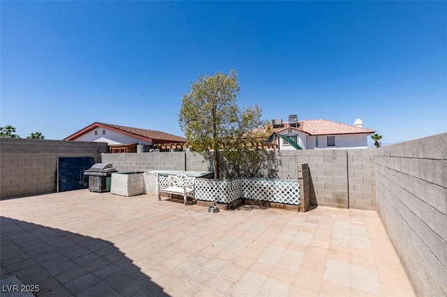 1905 Eskam St, Las Vegas, NV 89156 - fenced backyard with a patio area and a grill