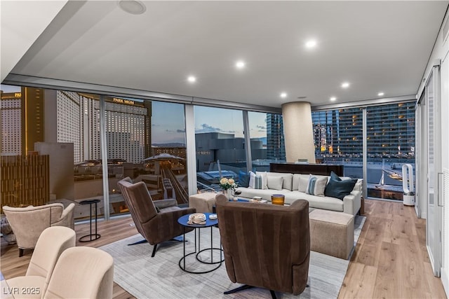 3726 Las Vegas Blvd Unit 606, Las Vegas, NV 89158 - living area featuring expansive windows, light wood-style flooring, recessed lighting, and a city view