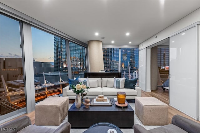 3726 Las Vegas Blvd Unit 606, Las Vegas, NV 89158 - living area with wood finished floors, expansive windows, and recessed lighting