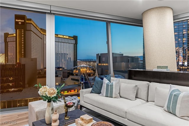 3726 Las Vegas Blvd Unit 606, Las Vegas, NV 89158 - living area with a city view, expansive windows, and wood finished floors