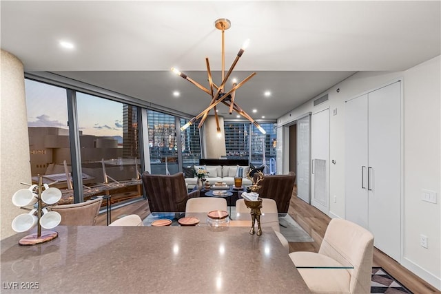 3726 Las Vegas Blvd Unit 606, Las Vegas, NV 89158 - dining space with a chandelier, wood finished floors, and recessed lighting