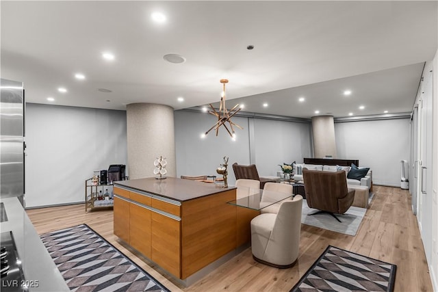 3726 Las Vegas Blvd Unit 606, Las Vegas, NV 89158 - interior space featuring light wood-type flooring, a kitchen island, dark countertops, recessed lighting, and modern cabinets