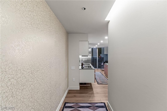 3726 Las Vegas Blvd Unit 606, Las Vegas, NV 89158 - hall with a sink, light wood-type flooring, recessed lighting, and baseboards