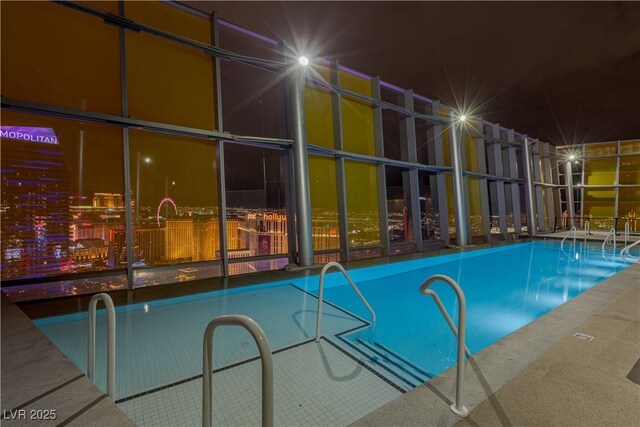 3726 Las Vegas Blvd Unit 606, Las Vegas, NV 89158 - pool at night with a community pool