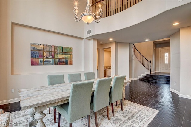10671 Capesthorne Way, Las Vegas, NV 89135 - dining space featuring baseboards, a chandelier, stairway, recessed lighting, and wood finished floors
