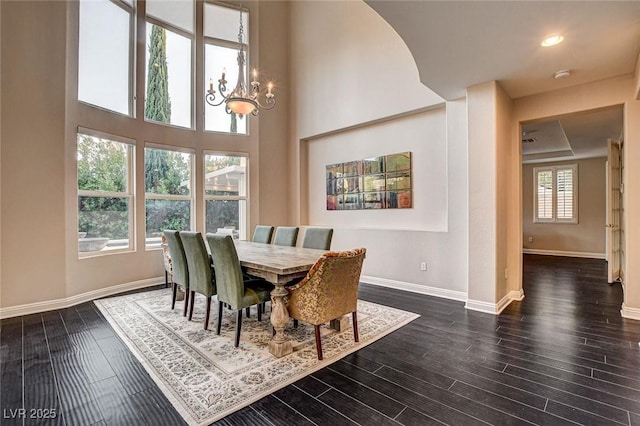 10671 Capesthorne Way, Las Vegas, NV 89135 - dining area with a chandelier, baseboards, dark wood-style flooring, and recessed lighting
