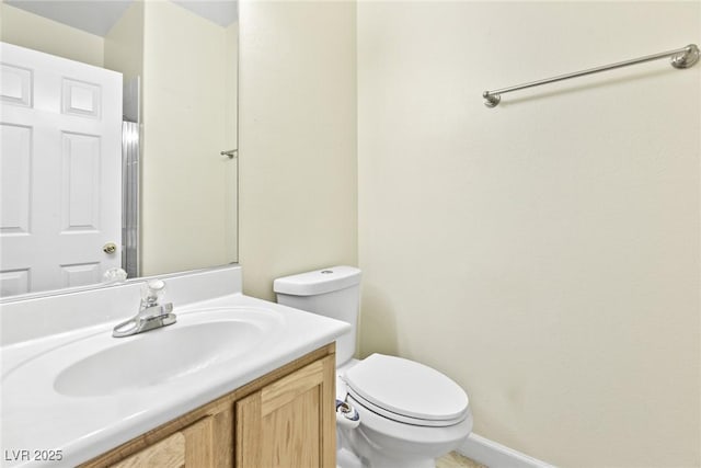 8221 Stoneheather Ct, Las Vegas, NV 89117 - bathroom featuring vanity, toilet, and baseboards