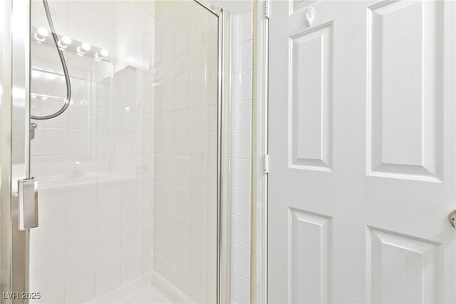 8221 Stoneheather Ct, Las Vegas, NV 89117 - bathroom featuring a shower stall