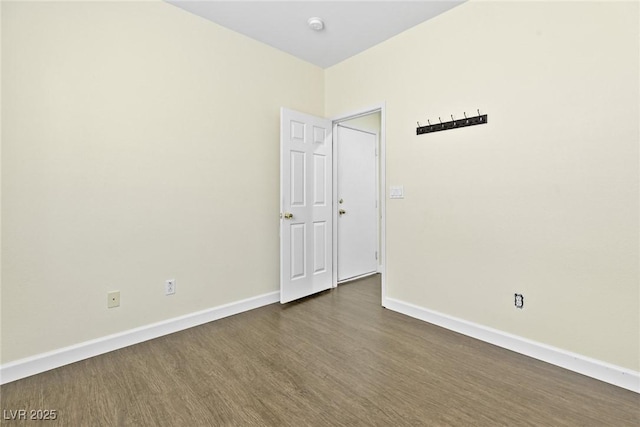 8221 Stoneheather Ct, Las Vegas, NV 89117 - empty room with dark wood-style floors, baseboards, and a smoke detector