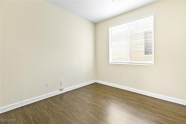 8221 Stoneheather Ct, Las Vegas, NV 89117 - empty room featuring dark wood-type flooring and baseboards