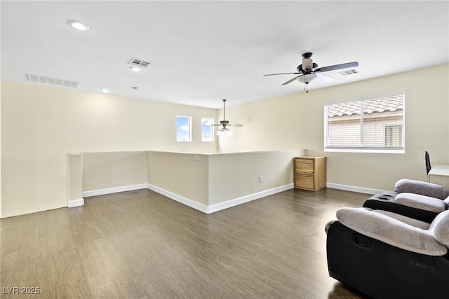 8221 Stoneheather Ct, Las Vegas, NV 89117 - living area featuring ceiling fan, wood finished floors, plenty of natural light, baseboards, and recessed lighting