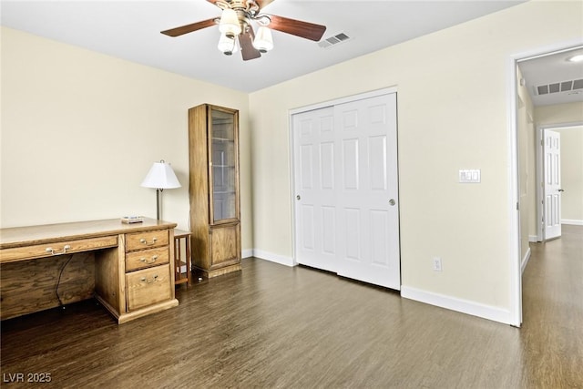 8221 Stoneheather Ct, Las Vegas, NV 89117 - unfurnished office with dark wood-type flooring, ceiling fan, and baseboards