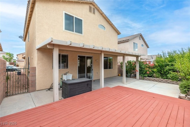 8221 Stoneheather Ct, Las Vegas, NV 89117 - deck featuring a patio and a gate